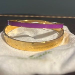Kate Spade bangles one gold and purple one gold with motivational says